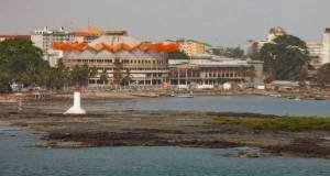 Conakry, Guinea, waterfront with buildings and a lighthouse